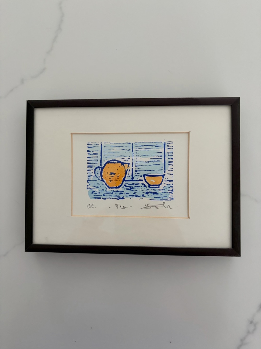 Framed linocut print by artist Libby Osmond Guy titled "Tea for Three”